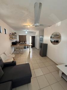 a living room with a couch and a table at Departamento Privado en Los Cabos in San José del Cabo