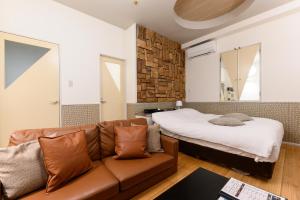 Ένα ή περισσότερα κρεβάτια σε δωμάτιο στο WEST INN hotel