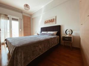 Ένα ή περισσότερα κρεβάτια σε δωμάτιο στο Athens Budget Rooms