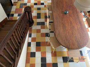 a hallway with a staircase with a colorful floor at Casamía in Medellín