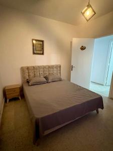 Ένα ή περισσότερα κρεβάτια σε δωμάτιο στο Coquette-Appart +5 φωτογραφίες