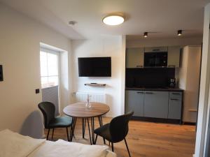 TV a/nebo společenská místnost v ubytování Leni Top 5