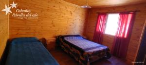 En eller flere senge i et værelse på Cabañas Estrella del Este
