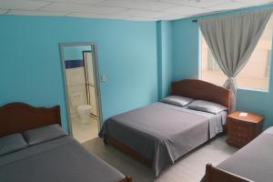 Postel nebo postele na pokoji v ubytování Hotel Bolivar