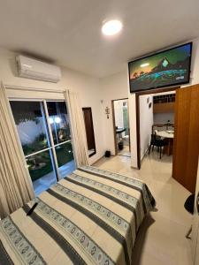 En eller flere senge i et værelse på Casa com piscina, 700M da praia