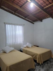 Giường trong phòng chung tại Luisa Rodriguez