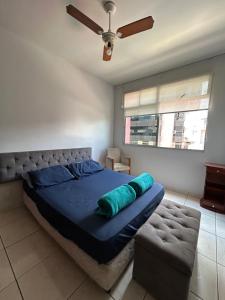 En eller flere senge i et værelse på Espaço Praia do Morro