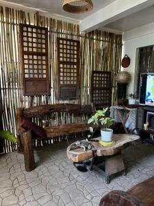 a living room with a couch and a table at Anton and Isabel Bangued- 2BR for 5 in Bangued