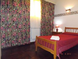 Ένα ή περισσότερα κρεβάτια σε δωμάτιο στο Continental Hotel