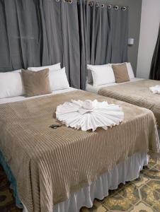 two beds sitting next to each other in a room at Pousada Maceio é Massa Pajuçara Frente ao Mar in Maceió +96 photos