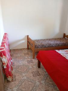 Ένα ή περισσότερα κρεβάτια σε δωμάτιο στο Casa do Luan