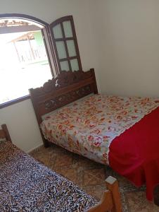 Ένα ή περισσότερα κρεβάτια σε δωμάτιο στο Casa do Luan