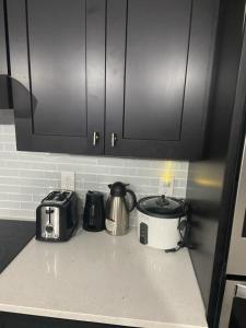 a kitchen counter with a toaster and a toaster and a toaster at Orlando 4 bedroom built in 2021 in Orlando