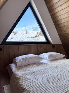 Ένα ή περισσότερα κρεβάτια σε δωμάτιο στο Lofty House Mountain