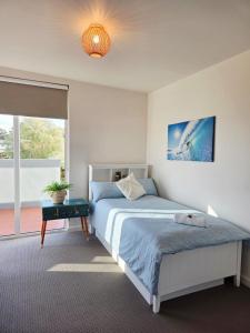 Ένα ή περισσότερα κρεβάτια σε δωμάτιο στο Bridport Breeze