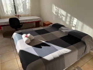 Ένα ή περισσότερα κρεβάτια σε δωμάτιο στο Cabañas Refugio Arqueologico