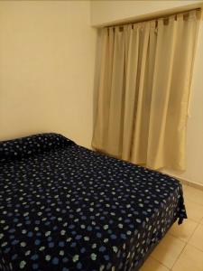 Ένα ή περισσότερα κρεβάτια σε δωμάτιο στο Mi lugar