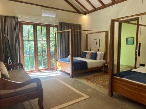 Giường trong phòng chung tại Mountain Villa & Nature Retreat - Fleur de Vie
