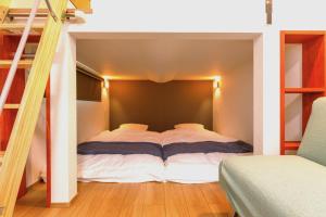 a bedroom with a bed in a room at Trailer Ship Garden Aso - Vacation STAY 09118v in Aso