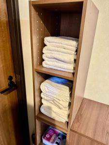 a towel rack with towels in a bathroom at Trailer Ship Garden Aso - Vacation STAY 09118v in Aso