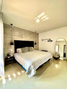 Voodi või voodid majutusasutuse Malecón a 450M, Alberca, Ideal para Carnaval toas