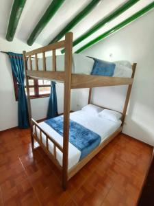 Postel nebo postele na pokoji v ubytování Roomiie Hostel