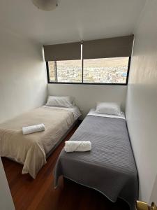 Ένα ή περισσότερα κρεβάτια σε δωμάτιο στο Apartment with spectacular ocean views