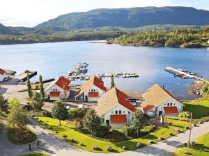 an aerial view of a house on the shore of a lake at 12 person holiday home in Jelsa in Fuglastein