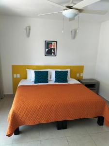 Ένα ή περισσότερα κρεβάτια σε δωμάτιο στο Hotel Majo Sayulita