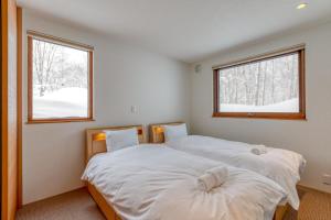 En eller flere senge i et værelse på Setna by H2 Life