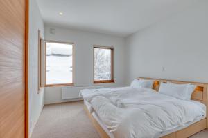 En eller flere senge i et værelse på Setna by H2 Life