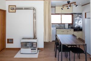 Kuchyň nebo kuchyňský kout v ubytování Furano Relax Stay C