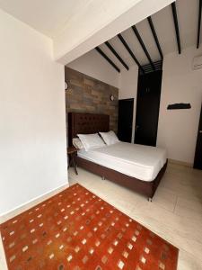 Ένα ή περισσότερα κρεβάτια σε δωμάτιο στο Casaserenapremium