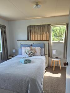 Voodi või voodid majutusasutuse Seaside Tahuna toas