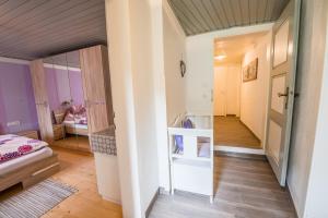 A bed or beds in a room at Ferienwohnung Wald