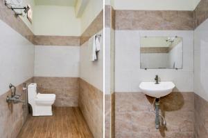 VadarevuHotel O Chirala Beach View Formerly Sea Shell Resort的带马桶和水槽的浴室