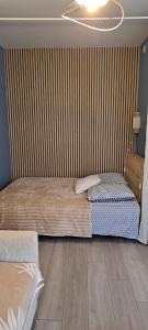 Postel nebo postele na pokoji v ubytování Le P'tit Gustave hyper centre Le Havre