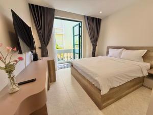 Postel nebo postele na pokoji v ubytování Minh Anh Hotel