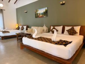 Voodi või voodid majutusasutuse Hotel Heladiv toas +110 fotot