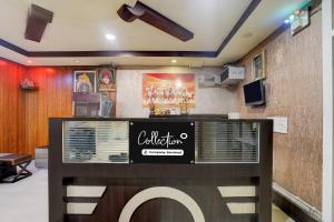 a restaurant with a sign on the wall at Collection O Jhalwar Road in Kota +23 photos