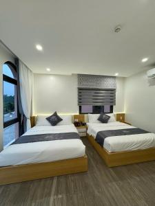 Una cama o camas en una habitación de The Hanok Hotel Do Son 30 fotos más