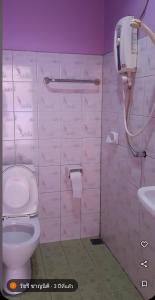 a bathroom with a toilet and a sink at Saran Resort room 13 in Ban Khok Wat