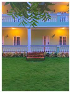 a bench sitting in front of a house at Le French Nest in Puducherry +71 photos