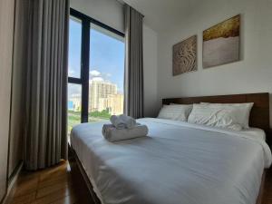 Ένα ή περισσότερα κρεβάτια σε δωμάτιο στο Grand Zenity D1 Residence +73 φωτογραφίες