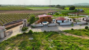 an aerial view of a building in a field at Aqua Dream Water Park in Bhuj