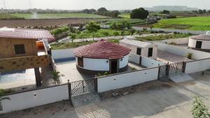 an aerial view of a house with a roof at Aqua Dream Water Park in Bhuj