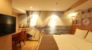 a bedroom with a bed and a tv and a boat at PAI Hotels·Jiangbei Airport Central Park in Chongqing