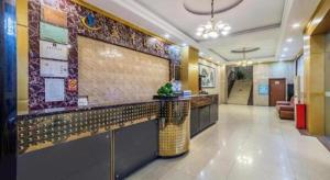 a lobby with a bar in a building at Ying Feng Yuan Hotel in Guangzhou