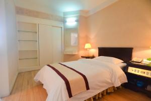 秦皇岛羊城酒店客房内的一张或多张床位 更多26张照片