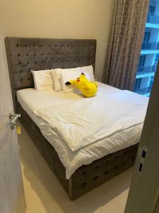 Ένα ή περισσότερα κρεβάτια σε δωμάτιο στο zada tower